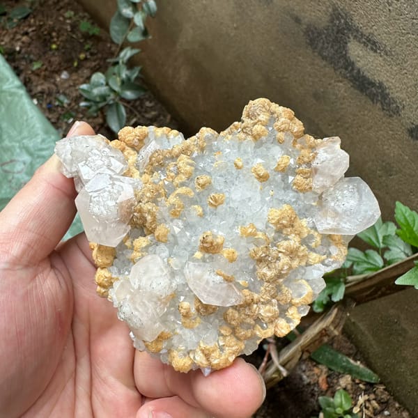 Pale pink calcite with tan dolomite crusts from Jiangxi, China, top view