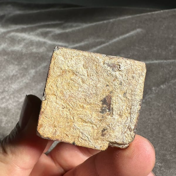 Large golden-brown limonite cube pseudomorph after pyrite from Guangxi, China, close-up of the crystal faces