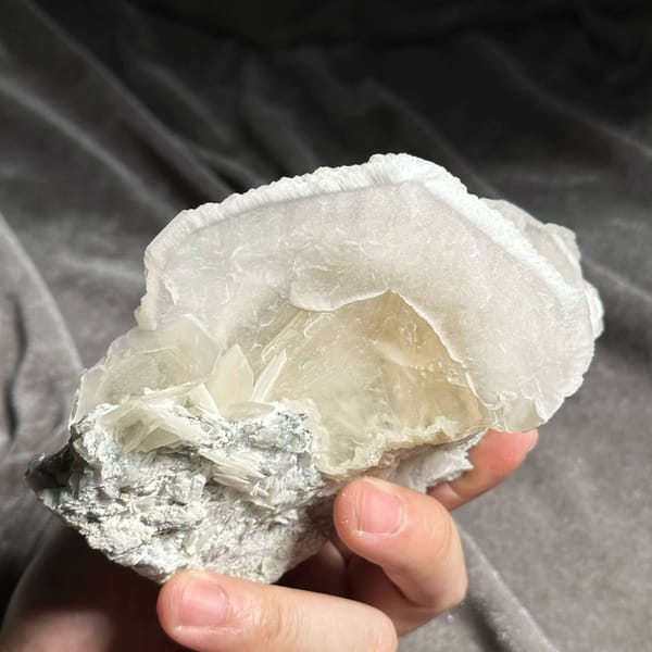 Large translucent platy calcite crystals stacked like petals from Hunan, China, top view