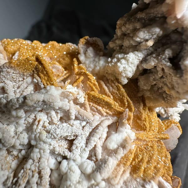 Orange-yellow mimetite on white aragonite and baryte from Morocco, top view