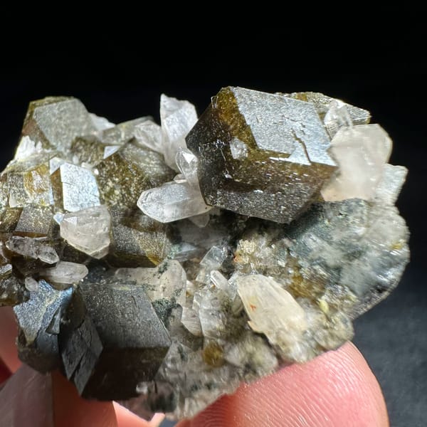 Interpenetrant-twinned garnet crystals with quartz from Inner Mongolia, China, close-up of the crystal faces