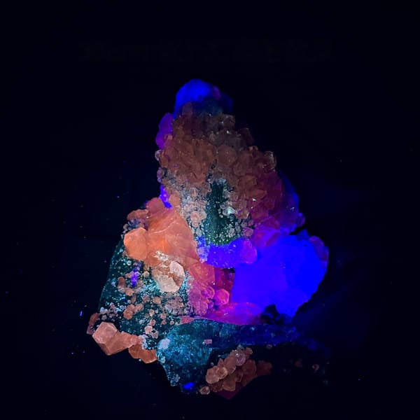 Mountain-shaped pale green fluorite cluster on dark quartz from Fujian, China, second angle