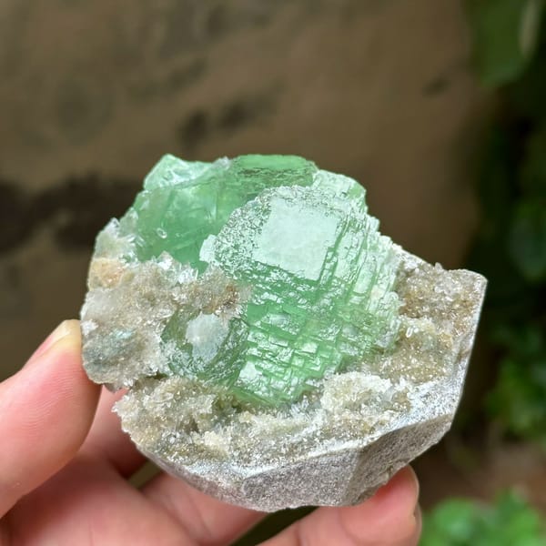 Cross-shaped stack of transparent green fluorite cubes from Fujian, China, second angle