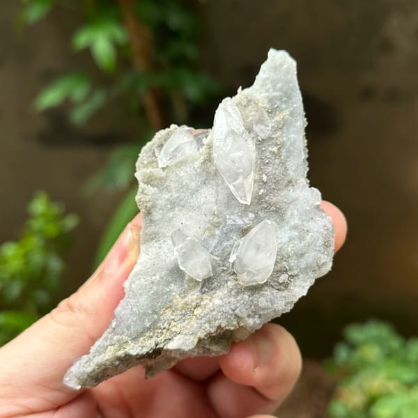 Double-terminated calcite on pale fluorite and quartz from Hunan, China, reverse side