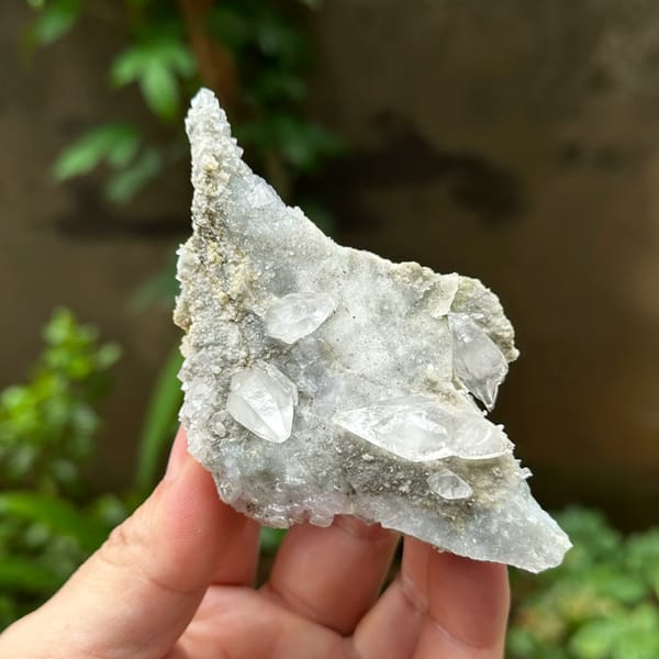 Double-terminated calcite on pale fluorite and quartz from Hunan, China, top view