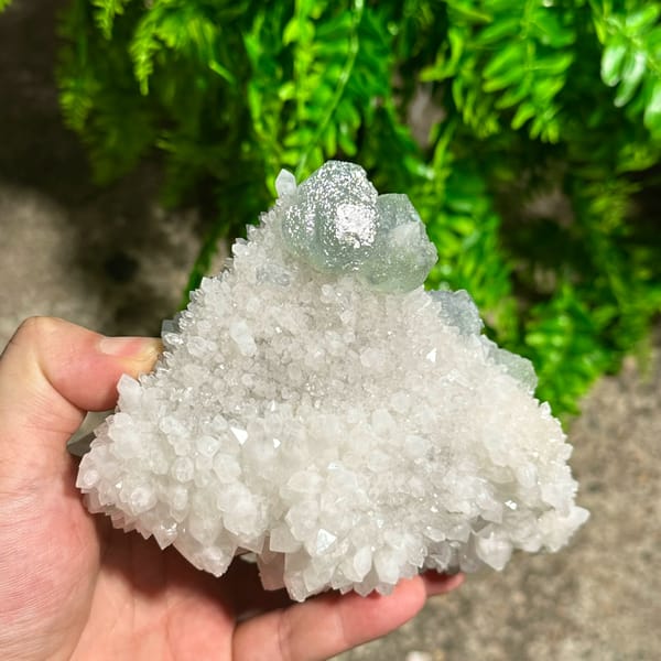 Large sparkling quartz floater with green fluorite cube from Fujian, China, second angle