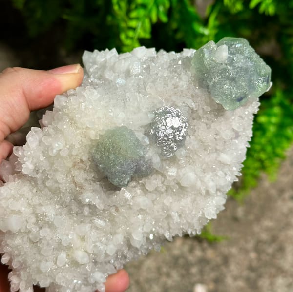 Large sparkling quartz floater with green fluorite cube from Fujian, China, top view