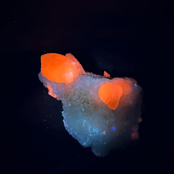 Iridescent calcite spire on sparkling white quartz from Fujian, China, second angle