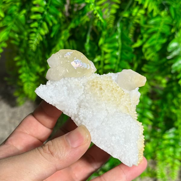 Iridescent calcite spire on sparkling white quartz from Fujian, China, reverse side