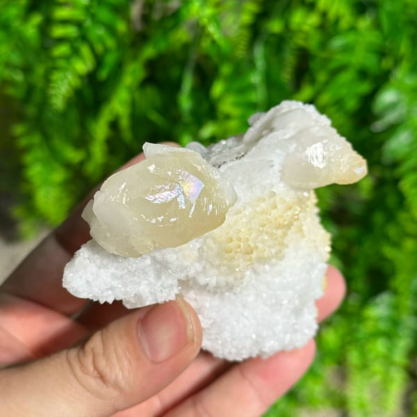 Iridescent calcite spire on sparkling white quartz from Fujian, China, top view