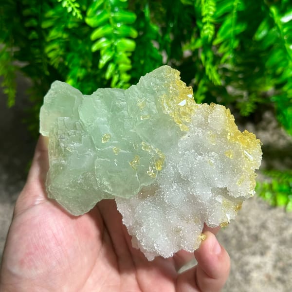 Yellow baryte floater with green fluorite and quartz druse from Jiangxi, China, close-up of the crystal faces