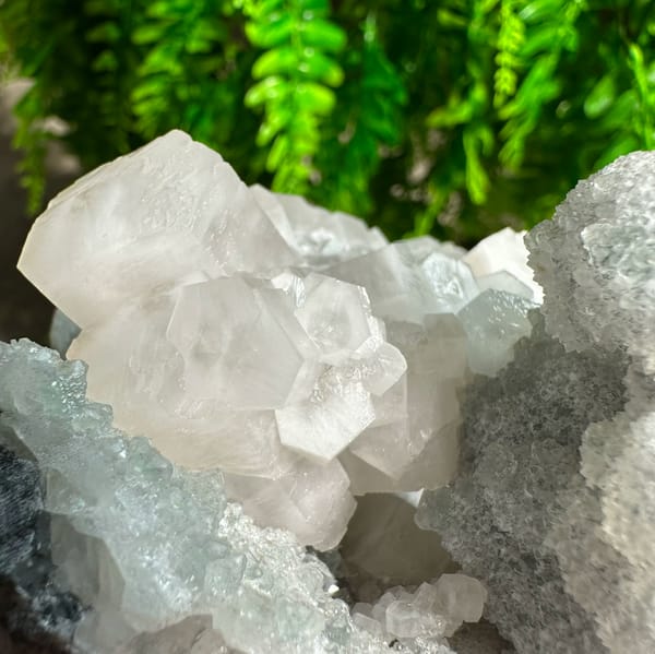 Frosted white prismatic calcite on grey quartz druse from Fujian, China, reverse side