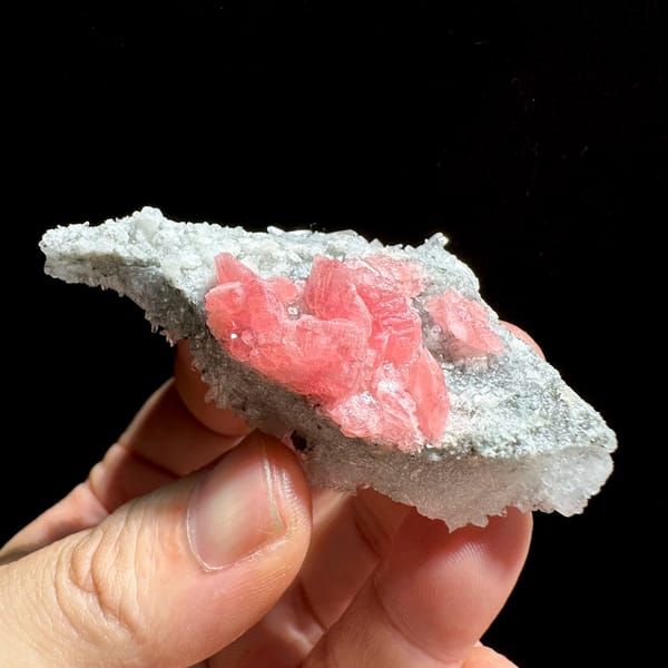 Rose-pink rhodochrosite cluster on white quartz needles from Wuzhou, Guangxi, China, second angle
