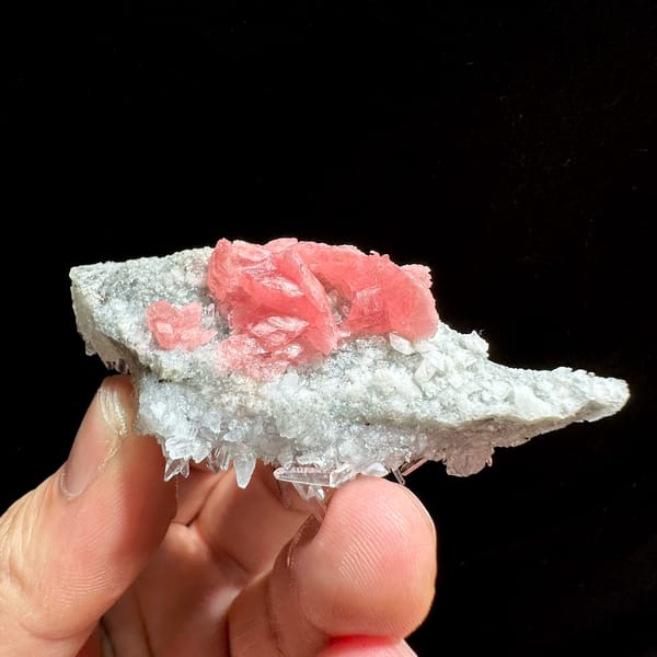 Rose-pink rhodochrosite cluster on white quartz needles from Wuzhou, Guangxi, China, reverse side
