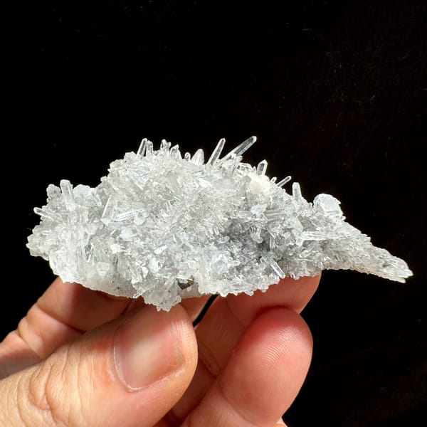 Rose-pink rhodochrosite cluster on white quartz needles from Wuzhou, Guangxi, China, top view