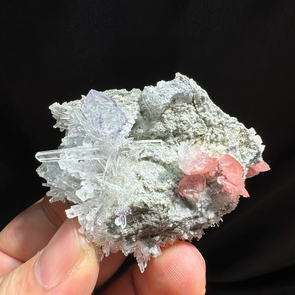 Pink rhodochrosite and purple fluorite with quartz needles from Wuzhou, Guangxi, China