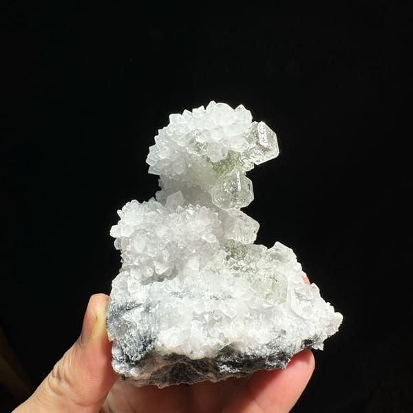 Transparent green fluorite cubes with inclusions on white quartz from Guangdong, China