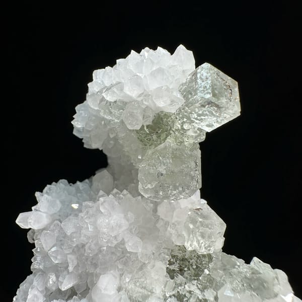 Transparent green fluorite cubes with inclusions on white quartz from Guangdong, China, top view