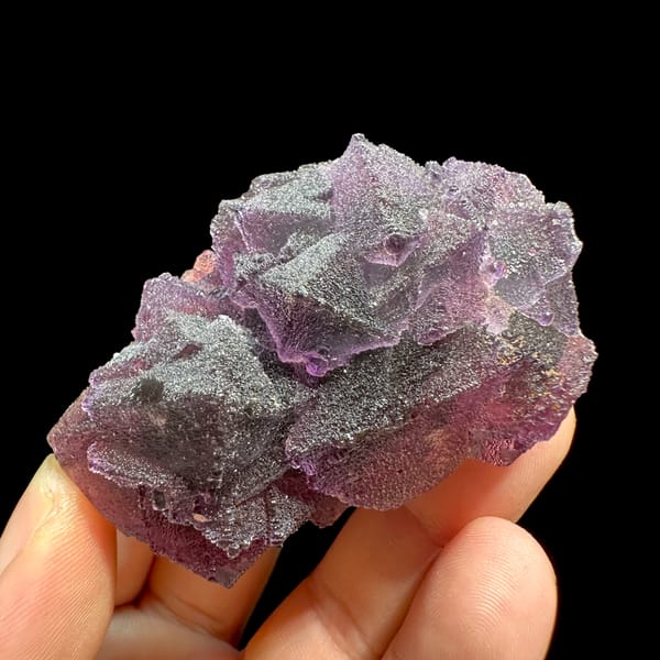 Purple and green stepped octahedral fluorite from Zhejiang, China, top view