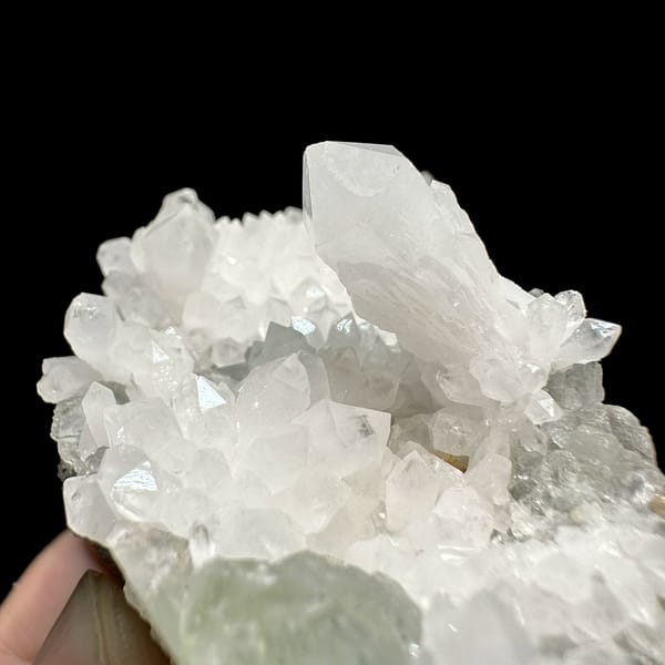White quartz druse plate with pale green fluorite from Guangdong, China, close-up of the crystal faces