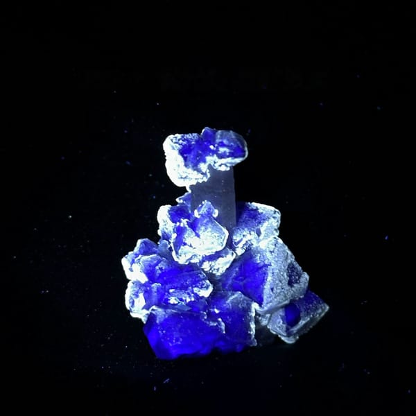 Violet fluorite octahedra on pale quartz prism from Inner Mongolia, China, second angle