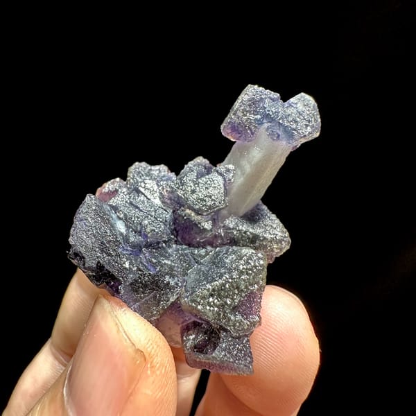 Violet fluorite octahedra on pale quartz prism from Inner Mongolia, China, top view