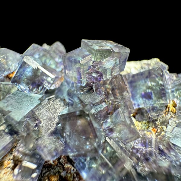 Glassy blue-green phantom fluorite cubes with pyrite dust from Fujian, China, reverse side