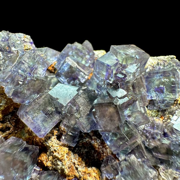 Glassy blue-green phantom fluorite cubes with pyrite dust from Fujian, China, top view