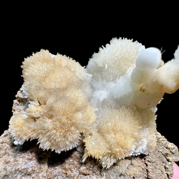 Yellow and white aragonite with hooked spire from Guizhou, China, close-up of the crystal faces