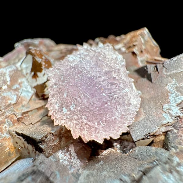 Purple creedite ball on iron-stained fluorite cubes from Guizhou, China, top view