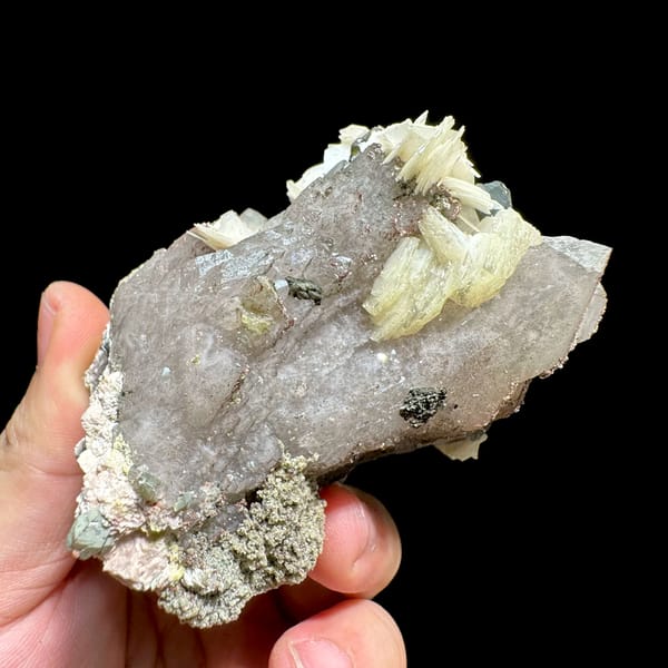 Tea-brown quartz block with calcite, feldspar and mica from Yunxiao, Fujian, China, close-up of the crystal faces