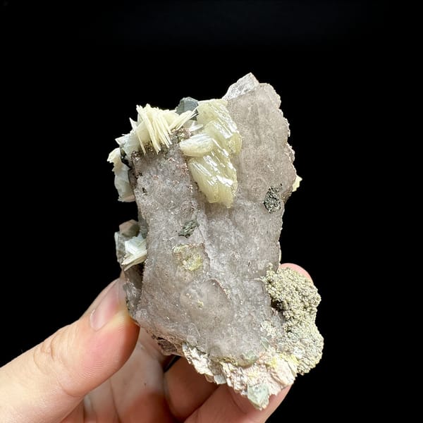 Tea-brown quartz block with calcite, feldspar and mica from Yunxiao, Fujian, China, detail of the matrix contact