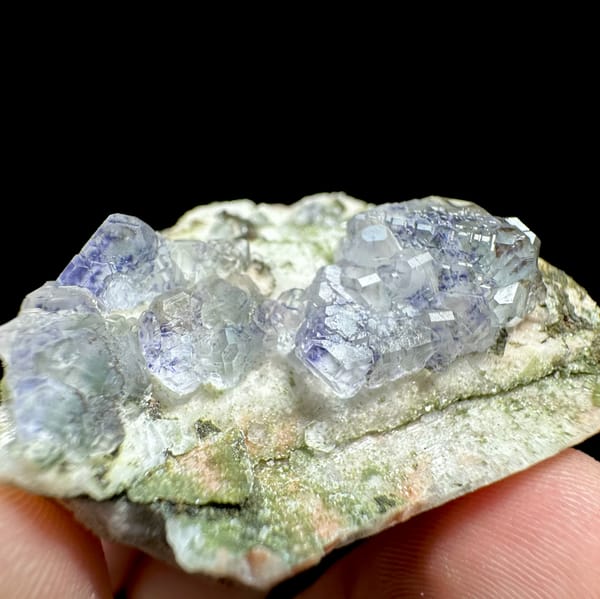 Pale blue fluorite octahedra on white feldspar from Yunxiao, Fujian, China, reverse side