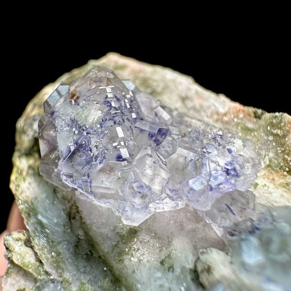Pale blue fluorite octahedra on white feldspar from Yunxiao, Fujian, China, top view