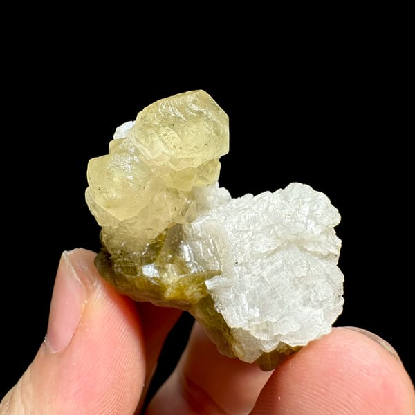 Golden-yellow calcite with white dolomite and siderite from Guizhou, China, close-up of the crystal faces