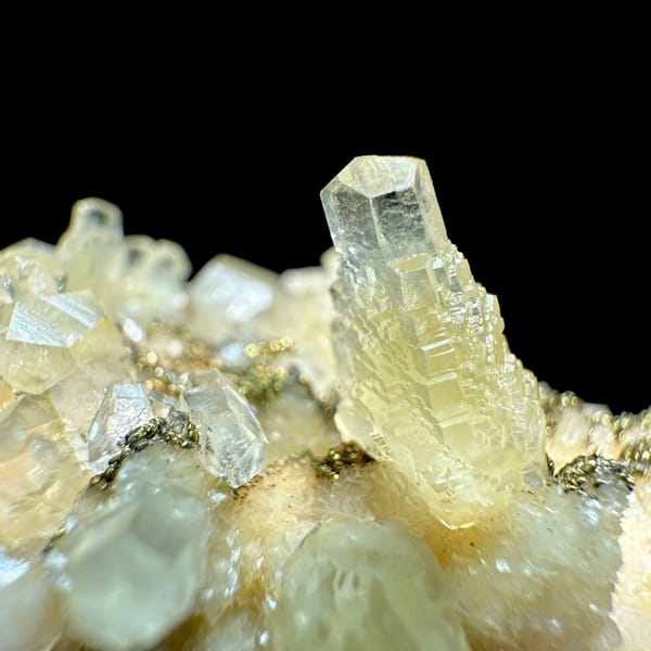 Feather calcite with brassy pyrite from Hubei, China, close-up of the crystal faces