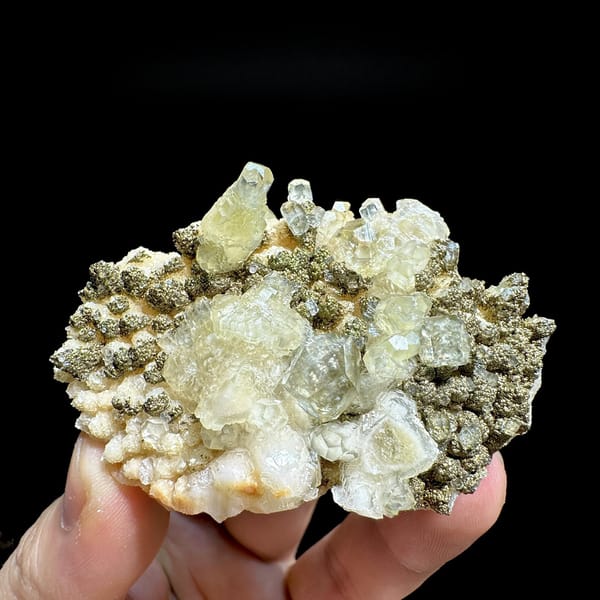 Feather calcite with brassy pyrite from Hubei, China, detail of the matrix contact
