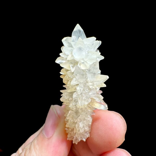 Slender pillar of stacked white calcite crystals from Yunnan, China, second angle