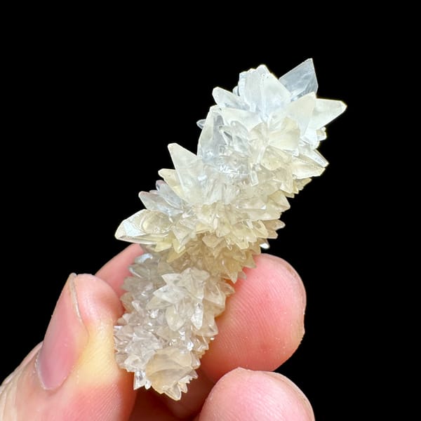 Slender pillar of stacked white calcite crystals from Yunnan, China, top view