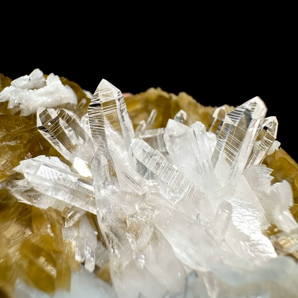 Clear quartz needles in hollow of golden siderite and dolomite from Guizhou, China, second angle
