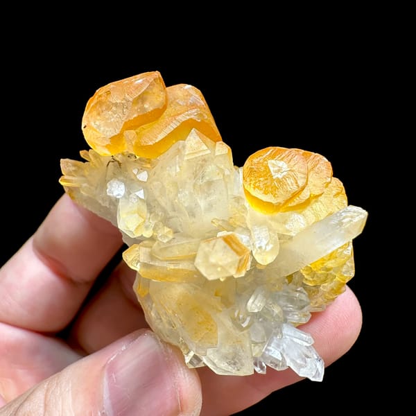 Orange-skinned calcite blades with clear quartz spire from Fujian, China, close-up of the crystal faces