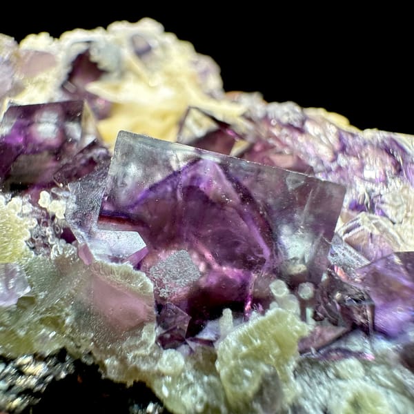 Glassy purple phantom fluorite cubes on cream siderite from Inner Mongolia, China, reverse side