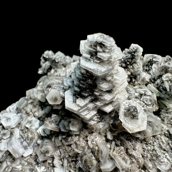 Hexagonal tower calcite crystals on grey quartz from Fujian, China, second angle