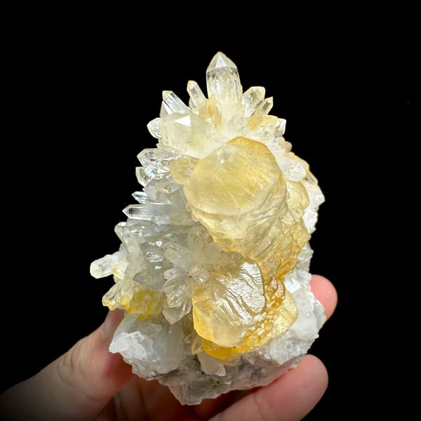 Golden-skinned calcite crystals with clear quartz spray from Fujian, China, top view