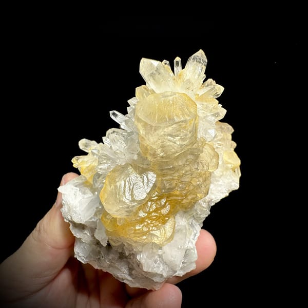 Golden-skinned calcite crystals with clear quartz spray from Fujian, China, detail of the matrix contact