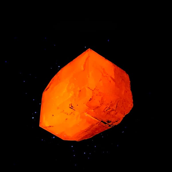 Large colourless calcite rhomb with pyrite from Fujian, China, second angle