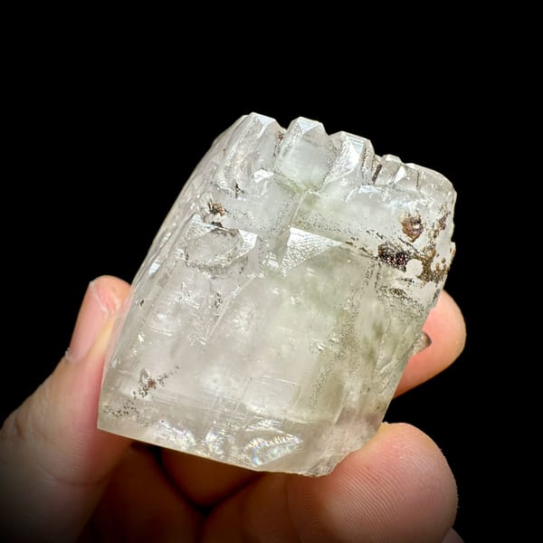 Large colourless calcite rhomb with pyrite from Fujian, China, reverse side