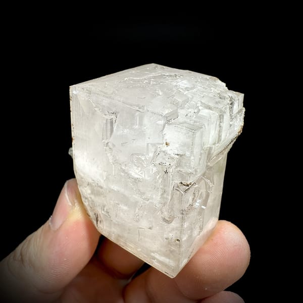 Large colourless calcite rhomb with pyrite from Fujian, China, detail of the matrix contact
