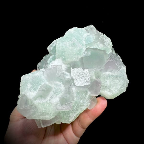 Twinned purple and green sugar fluorite cubes from Jiangxi, China, close-up of the crystal faces