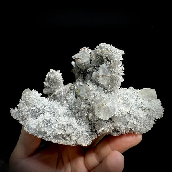 Star calcite crystals on grey quartz needles with pyrite from Fujian, China, detail of the matrix contact